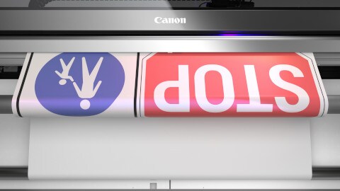 STOP traffic sign being printed on the Canon Colorado printer
