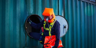 Firefighter wearing confined space breathing apparatus equipment
