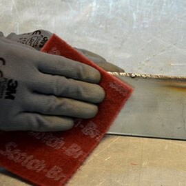 Weld burn removal with Scotch-Brite Hand Pad