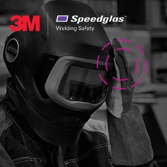 welder wearing 3M speedlgas welding helmet taping head
