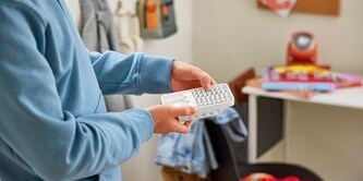 Attach Command strips to the backplate of the Command folding clothes hanger.
