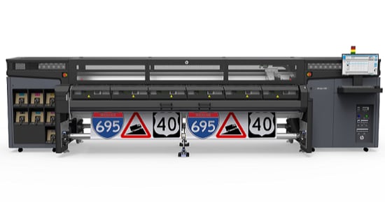 A wide grey digital sign printer.
