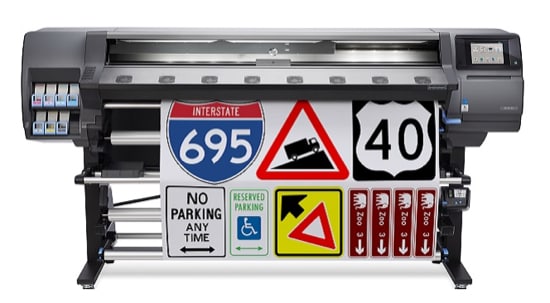 A digital sign printer with a sheet printed that has a variety of road signs.