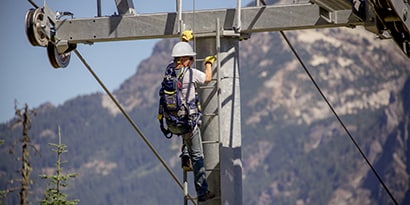 Man climbing a metal ladder in his post fall arrest training