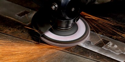 Deburring metal with a flap disc
