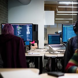 two workers in a contact center working