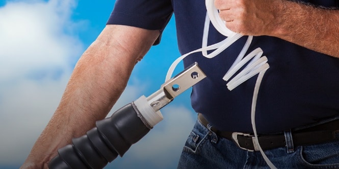 Person holding a power cable connector
