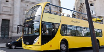 A yellow bus on the road
