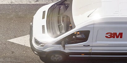 White cargo van with 3M cooling film on the rooftop.
