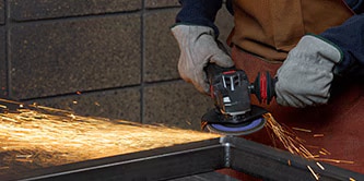 grinding weld removal on metal seam
