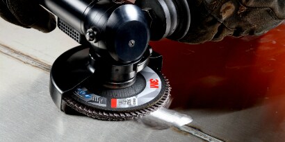 Grinding a weld with a flap disc
