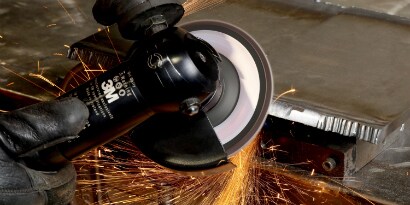 Beveling a metal edge with a flap disc
