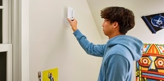 Slide Command folding clothes hanger back on the wall
